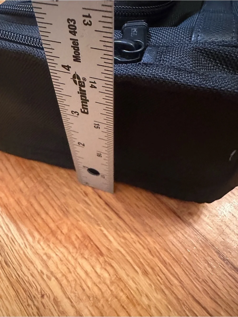 Tumi  hanging travel kit  with hook for hanging.